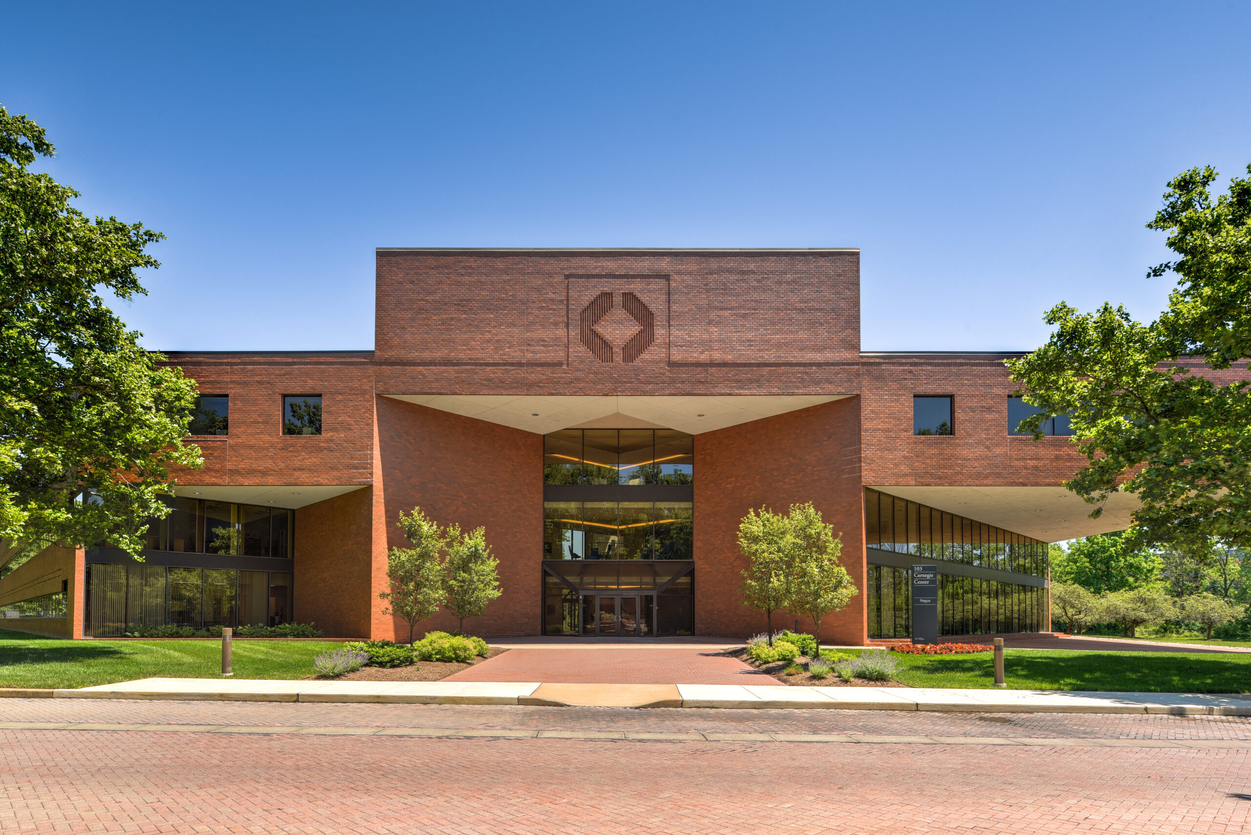 Exterior front elevation of a brick office building entrance.