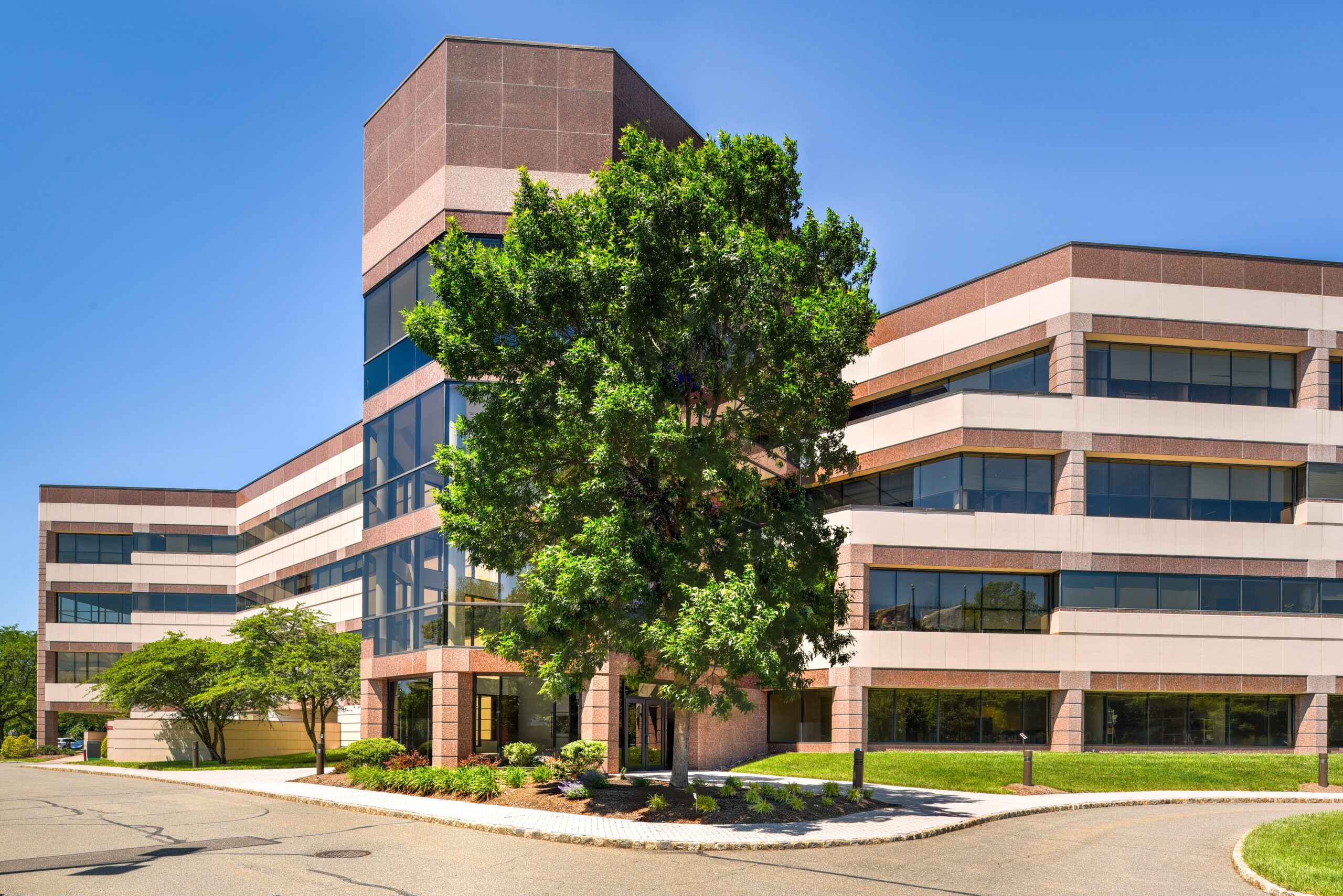 Exterior side angle shot of a precast office building.