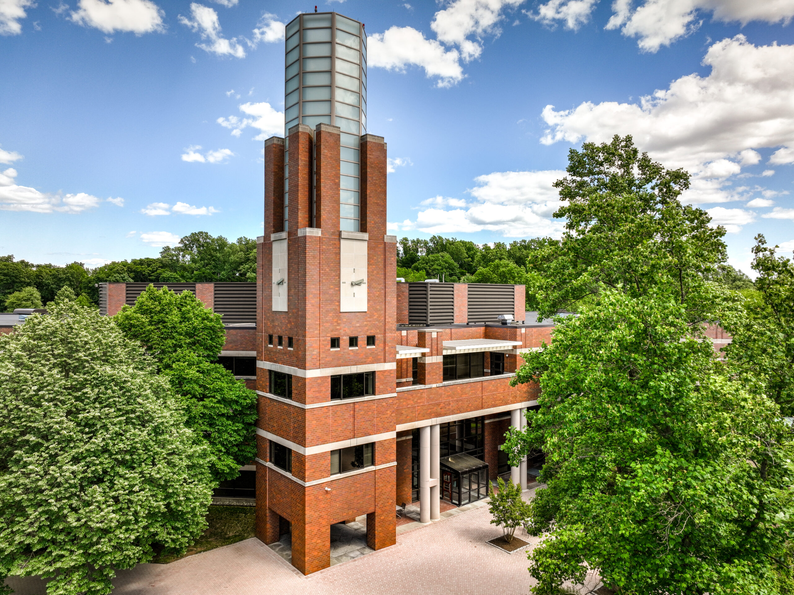 Ariel view of a brick office building featuring a clock tower.